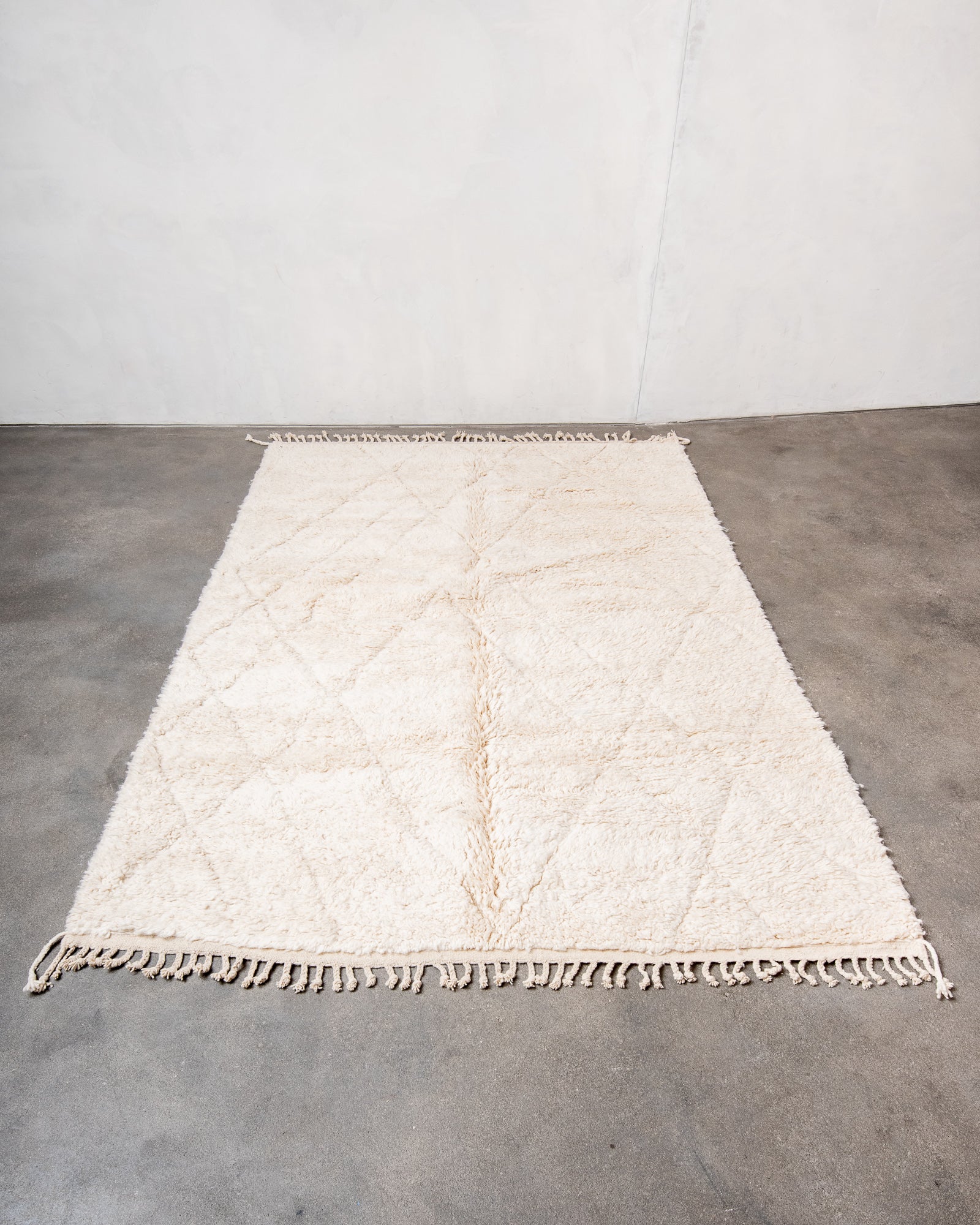 Modern, designer, handcrafted Berber rug from Morocco. Beniourain carpet with beautiful colours and patterns and fluffy wool texture.